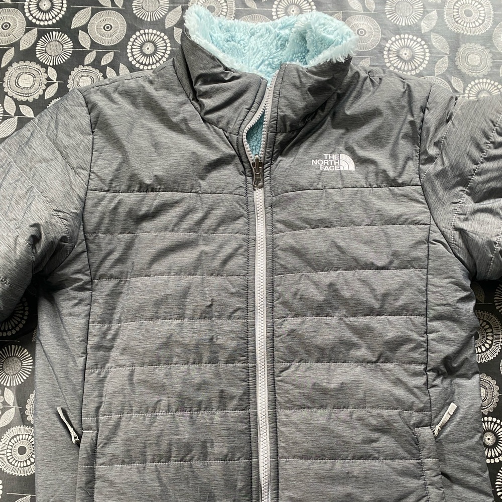 The North Face reversible girls jacket.  Size XL. Grey with powder blue.